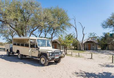 Relaxing poolside Boteti River Camp Makgadikgadi Botswana budget safari zebra migration