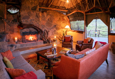 Elewana lounge area with fireplace