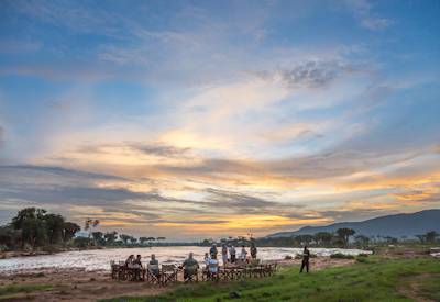 Sunset drinks and sundowners on the banks of Ewaso Nyiro River