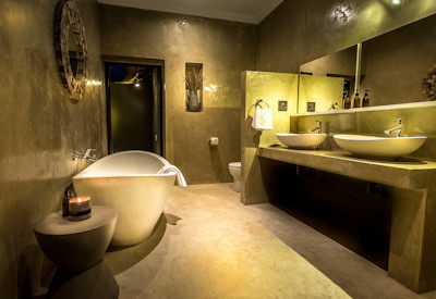 Private bathrooms with bath tubs and showers