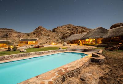 Village main swimming pool with sweeping rock face