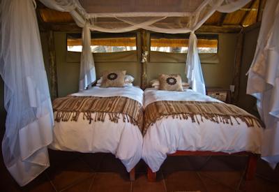 Twin beds with mosquito nets
