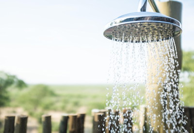 Outdoor rain showers overlooking a watering hole