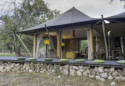 Sunset drinks and fire pit overlooking watering hole