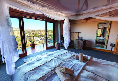 Double bed and stunning views of the Windhoek bushveld