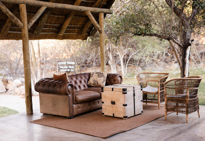 Outdoor lounge with white seringa trees
