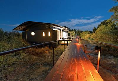 Wooden walkways to a standard twin room
