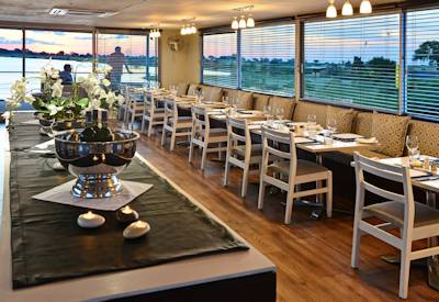 Dining room and twin beds on this safari boat