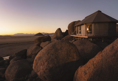 Bedroom tents are perfect located on granite boulders in authentic desert