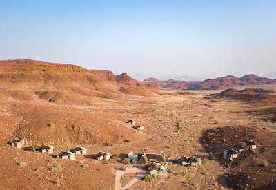 Damaraland Camp tented rooms rock pool desert-adapted elephant tracking Namibia safari