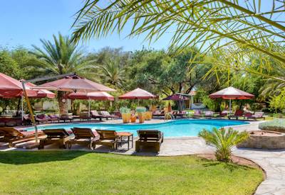 Namib Desert Lodge swimming pool ancient desert landscape Sossusvlei Shuttle Namibia