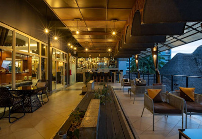Hôtel des Mille Collines main covered lounge dining area local Rwandan artists Rwanda