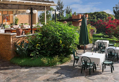 Hôtel des Mille Collines La Terrasse pool deck restaurant 90% local ingredients Rwanda