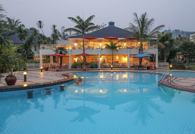 Lake Kivu Serena Hotel large outdoor pool sun deck palm trees gardens Rwanda