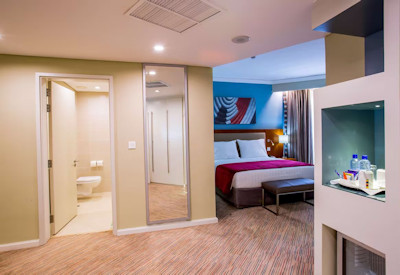 Park Inn by Radisson Kigali beautiful en-suite bedroom soft soothing hues Kigali Rwanda