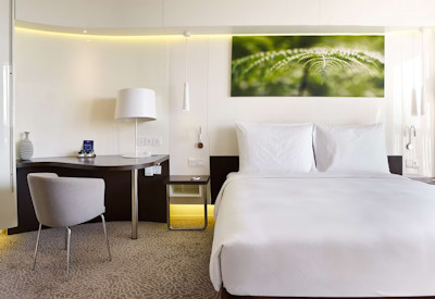 Radisson Blu Hotel Kigali en-suite guest bedroom earth-toned decor balcony views Rwanda