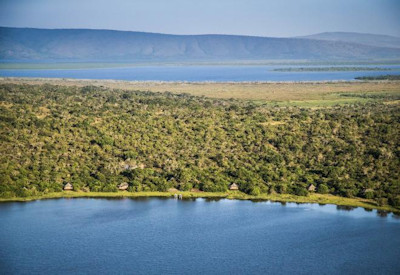 Ruzizi Tented Camp Lake Ihema shores fig trees palms deck over lake Akagera Rwanda