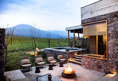 Singita Kataza House outdoor firepit heated plunge pool master bedroom Rwanda