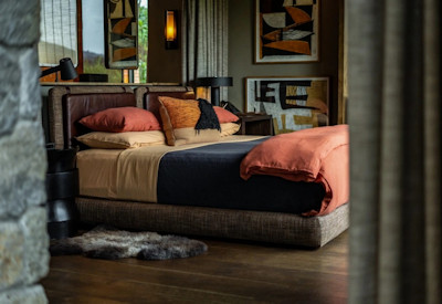 Singita Kwitonda Lodge classic luxury suite sitting area veranda Rwanda