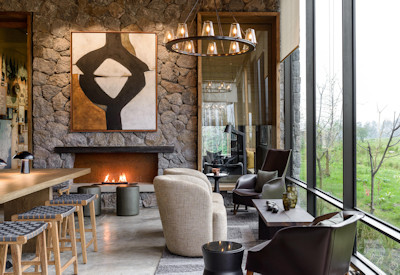 Singita Kwitonda Lodge lounger lush forest vistas Volcanoes National Park Rwanda