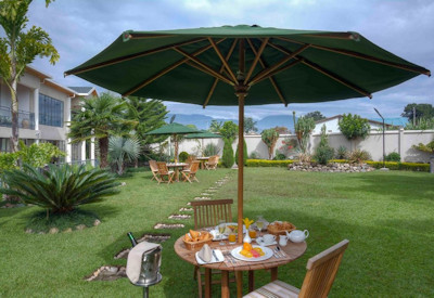 The Bishop's House garden tea serene Musanze colonial retreat Volcanoes National Park Rwanda
