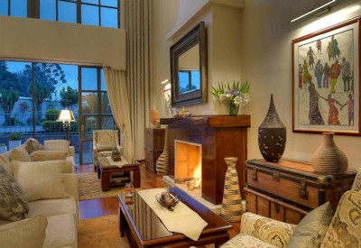 The Bishop's House main lounge roaring fireplace colonial-style Musanze Rwanda