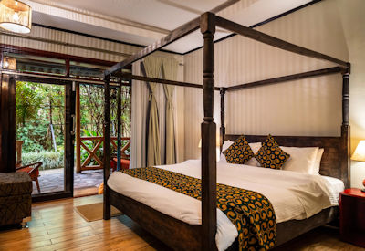 Tiloreza Volcanoes Ecolodge lounge fireplace shared living area relaxed after gorilla trekking Rwanda