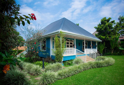 Tiloreza Volcanoes Ecolodge gardens lawns Virunga mountain views walking distance Volcanoes National Park Rwanda