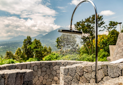Virunga Lodge outdoor shower Lakes Ruhondo Bulera views Volcanoes Safaris Rwanda