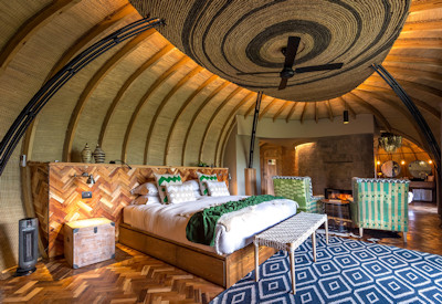 Wilderness Bisate beehive en-suite 91m² forest villa central fireplace private deck Rwanda