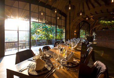 Wilderness Bisate dining table Bisoke Karisimbi Mikeno volcano views Rwanda