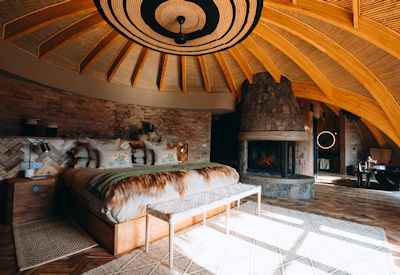 Wilderness Bisate Reserve utmost luxury Rwanda Rwandan royal palace design forest villa