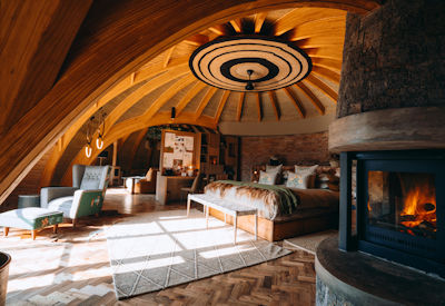 Wilderness Bisate Reserve stunning villa cosy fireplace fine linen deep soaking tub Rwanda