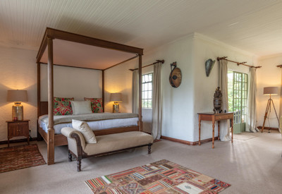 Wilderness Sabyinyo Silverback Lodge large luxurious four-poster king suite fireplace Rwanda