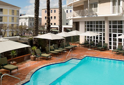 Swiming pool with sun loungers