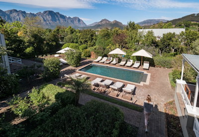 Saltwater pool and sun loungers at Plumwood