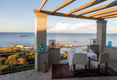 Tintswalo Boulders suite bedroom False Bay views refined coastal décor boutique hotel Cape Peninsula