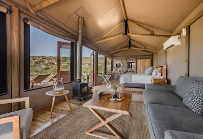 Air-conditioned luxury safari suite interior with fireplace at Amakhala Bukela Lodge Eastern Cape