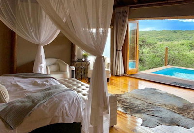 Tented safari suite overlooking game-filled plains at Amakhala Bush Lodge Eastern Cape
