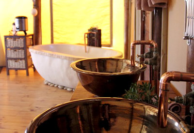 Deep freestanding bath and outdoor shower at Amakhala Bush Lodge Amakhala Game Reserve Eastern Cape