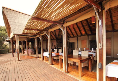 Outdoor viewing deck with fireplace and African starlit sky at Amakhala Bush Lodge Eastern Cape
