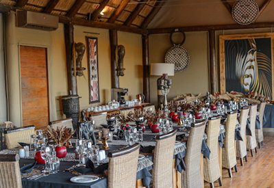 Thatched indoor dining and lounge area at Amakhala Bush Lodge Amakhala Private Game Reserve