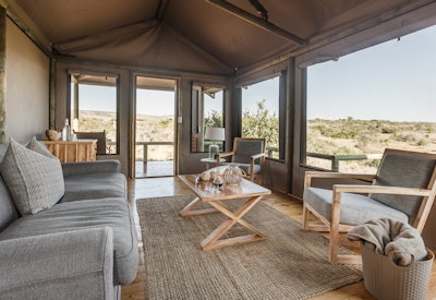 Sweeping Eastern Cape grassland views from verandah at Amakhala Hlosi Lodge Amakhala Reserve