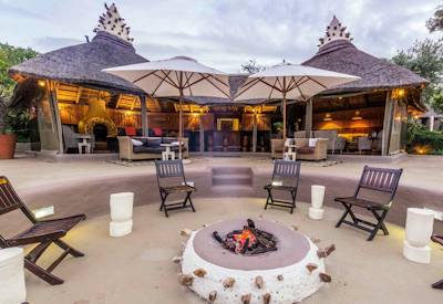 Amakhala Safari Lodge thatched suites in indigenous bushveld valley Amakhala Game Reserve
