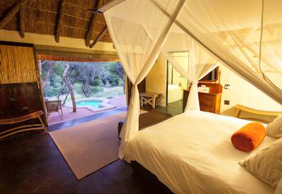 Thatched luxury safari suite with stone-capped rooftop at Amakhala Safari Lodge Eastern Cape