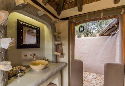 Indoor and outdoor double shower at Amakhala Safari Lodge Amakhala Private Game Reserve