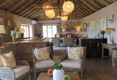 Thatched lounge and indoor dining area at Amakhala Woodbury Lodge Amakhala Game Reserve