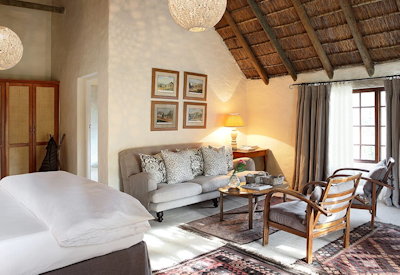 Spacious bedroom with private veranda and sitting area at The Elephant House Addo Eastern Cape