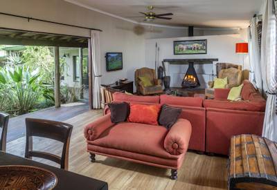 Cosy main lounge with large fireplace at Kariega Homestead Kariega Private Game Reserve Eastern Cape