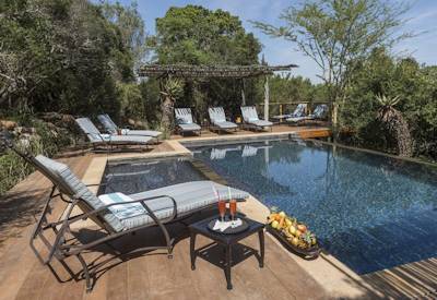Swimming pool with viewing decks and Eastern Cape bushveld views at Kariega Main Lodge